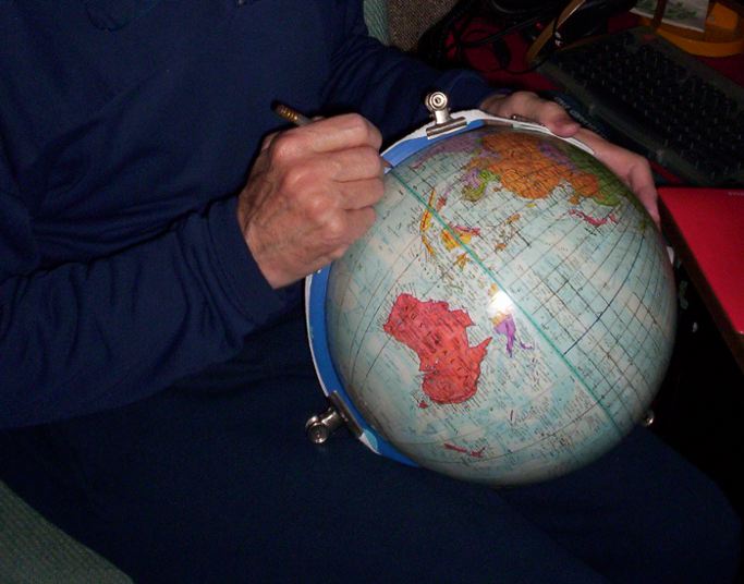 Gene Keyes pencilling 5-degree grid on 10-inch globe.